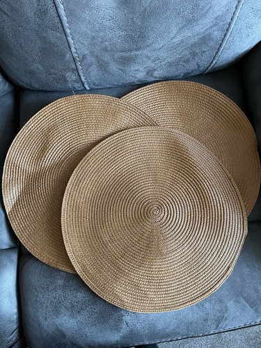 Three brown woven table mats